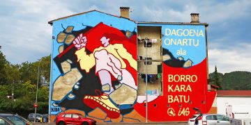EKIDA pinta un mural en Ordizia con el lema del próximo Gazte Topagune Sozialista